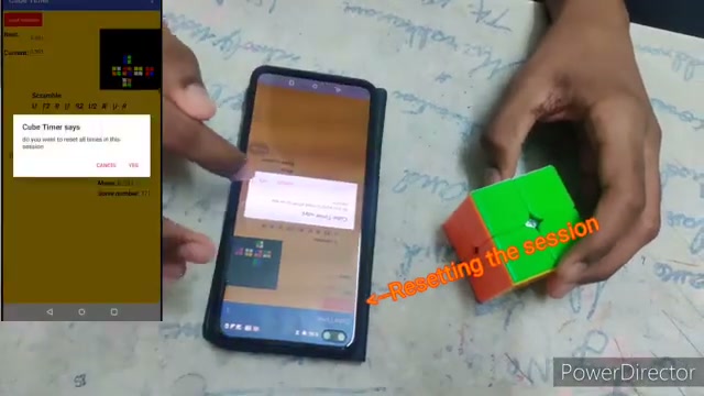 Cube Timer app running beside a Rubik's Cube